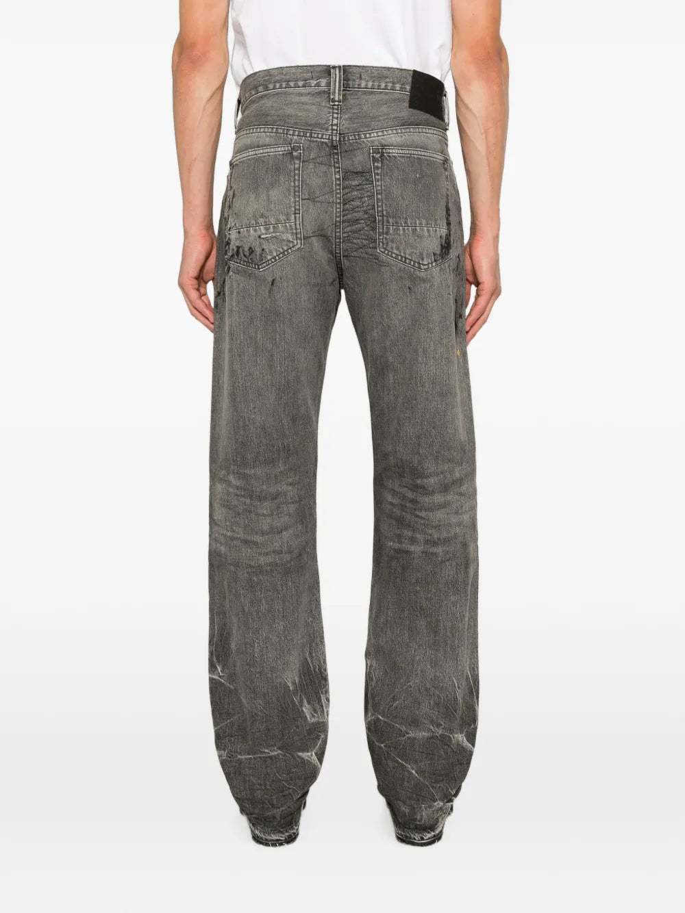 distressed paint-splatter jeans