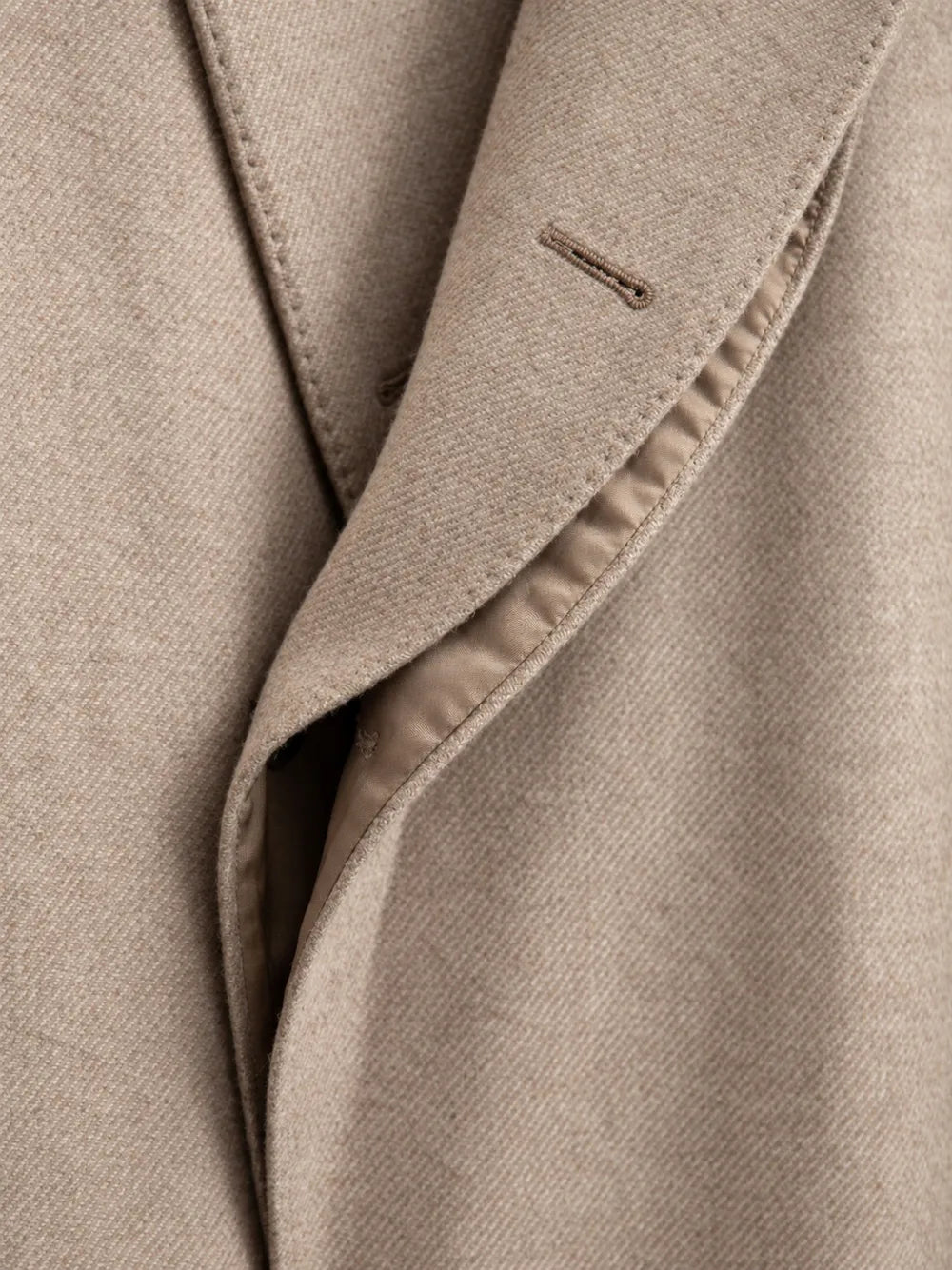 double-breasted peak-lapel coat